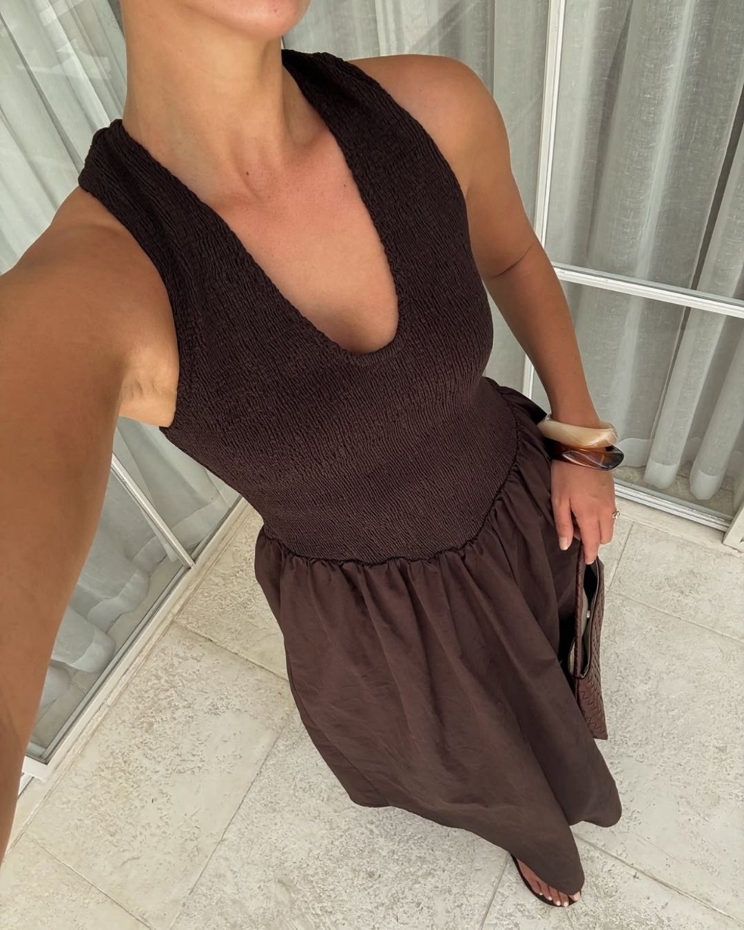 Resin bangle and brown halter dress